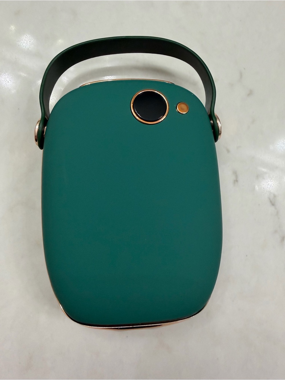 Green hand warmer and power bank with carry handle